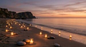 Sunset over beach with candles and stones arranged for cremation memorial in Salisbury, NC